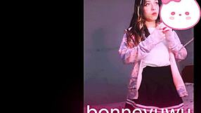 Bonneyuwu the cute petite Argentinian teen masturbates on bed in skirt