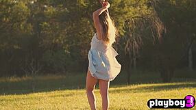 Petite brunette teen model poses naturally with big tits outdoors at photoshoot