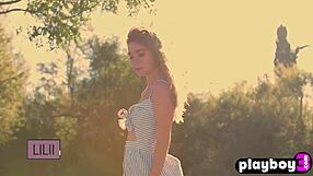 Petite brunette teen model poses naturally with big tits outdoors at photoshoot