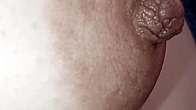Hard nipple fills screen in raw close-up piano focus