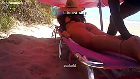 ebony oils up married latina's fat ass on beach then fingers gaping holes