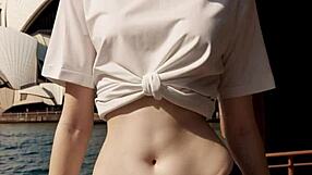 lingerie model poses barefoot at sydney opera house