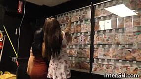 Jezabel and Sarah Suck White Cock Through Glory Hole with Big Ebony Tits