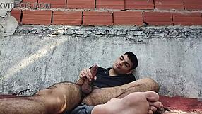 sexy guy jerks big cock sensually outdoors on sunny day floor