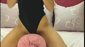 webcam girl dances on pillow in tight unitard shaking her ass