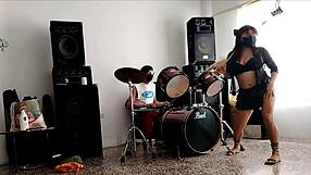 drummers play beats, she strips dancing and shakes huge ass