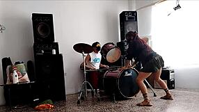 drummers play beats, she strips dancing and shakes huge ass