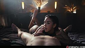 A sexy tattooed brunette Latina smokes a cigarette slowly while sucking my cock in POV