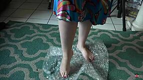 brunette nerd femdom dances barefoot playing with toes