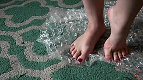 brunette nerd femdom dances barefoot playing with toes