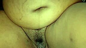 Damn ebony stepmom rubs her big clit and hairy pussy lips till she cums hard