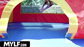 check out this tall milf getting fucked hard in the bounce house trailer