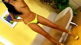 the horny brunette babe slips off her thong and fingers her shaved pussy till she cums hard.