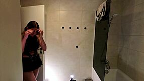 horny milf wife flashes big boobs through see-through top in bathroom leather skirt