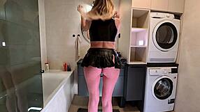 horny milf wife flashes big boobs through see-through top in bathroom leather skirt
