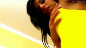 the horny brunette babe slips off her thong and fingers her shaved pussy till she cums hard.