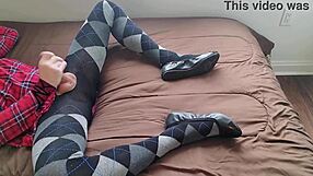Shemale jerks off in plaid dress and argyle tights