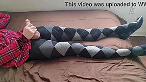 Shemale jerks off in plaid dress and argyle tights