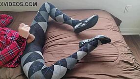 Shemale jerks off in plaid dress and argyle tights