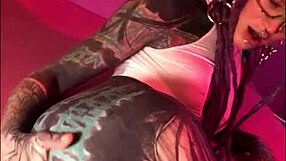 Dreadlocks and tattoos girl does latex anal fisting solo