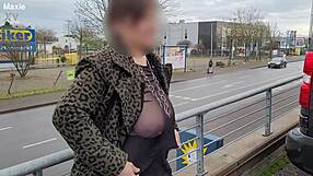 a milf with a sheer top exposed her big tits in the street